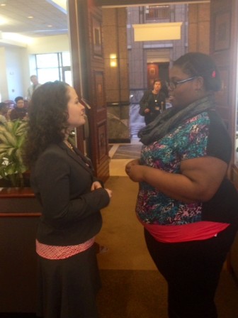 Child Advocate Sarah Healy Eagan and Laquandria talk outside the hearing.