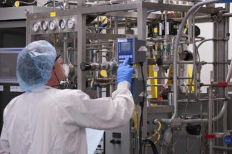 An employee manufactures product for Flublok at Protein Sciences, Meriden.