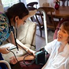 Nurse Tish Allen checks Judy Taber’s blood pressure.
