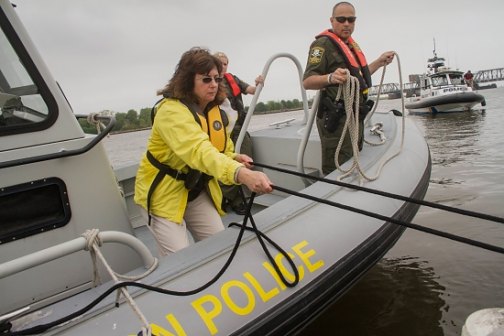 Eleanor Mariani, state boating official, secures a line during a training exercise with Conn. Environmental Conservation Police officers.