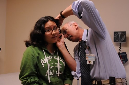 Karin Gonzalez, 12, of Glastonbury is examined by Dr. Frederick Bogin, medical director of the Pediatric and Adolescent Medicine Clinic at Saint Francis Hospital and Medical Center, which is using the index to better serve its patients.