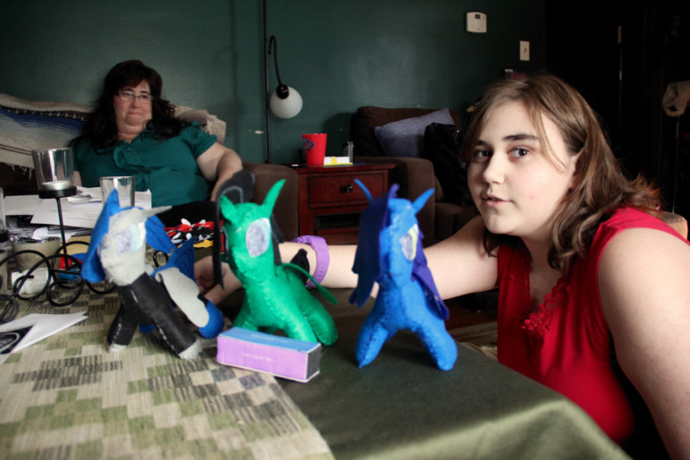Rebekah Vincent, 12, of Wallingford, displays creatures that she created by hand, as Kimberly, her mom, looks on. 