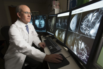 Dr. David Gruen, director of Women's Imaging at Stamford Hospital, reviews a 3-D image.