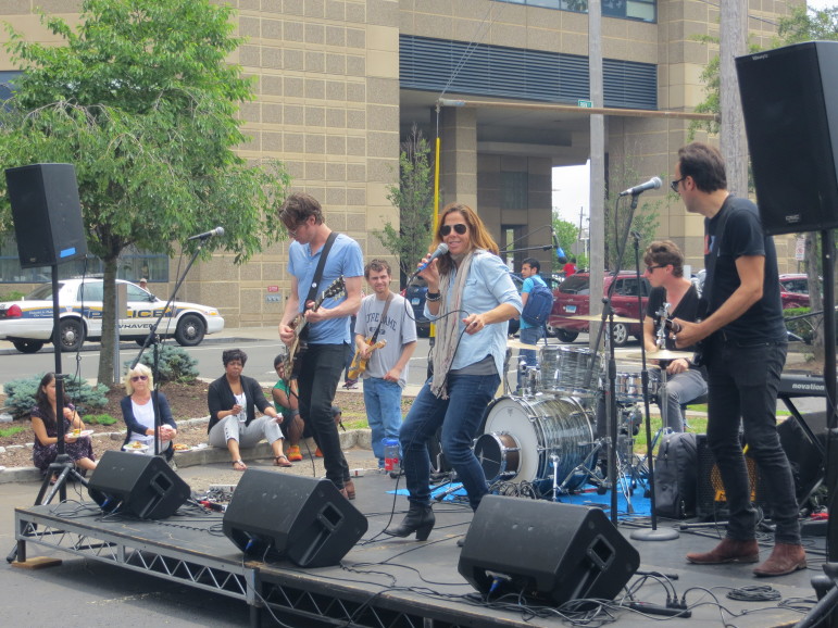 Mary McBride and her band perform outside the Conn. Mental Health Center, New Haven.