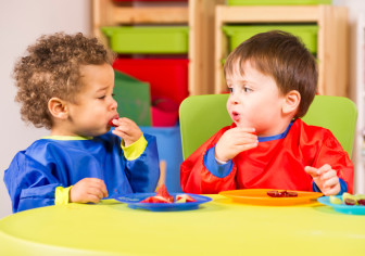 Family-based day care centers can shape a child's eating habits by offering healthy snacks, such as fruit.